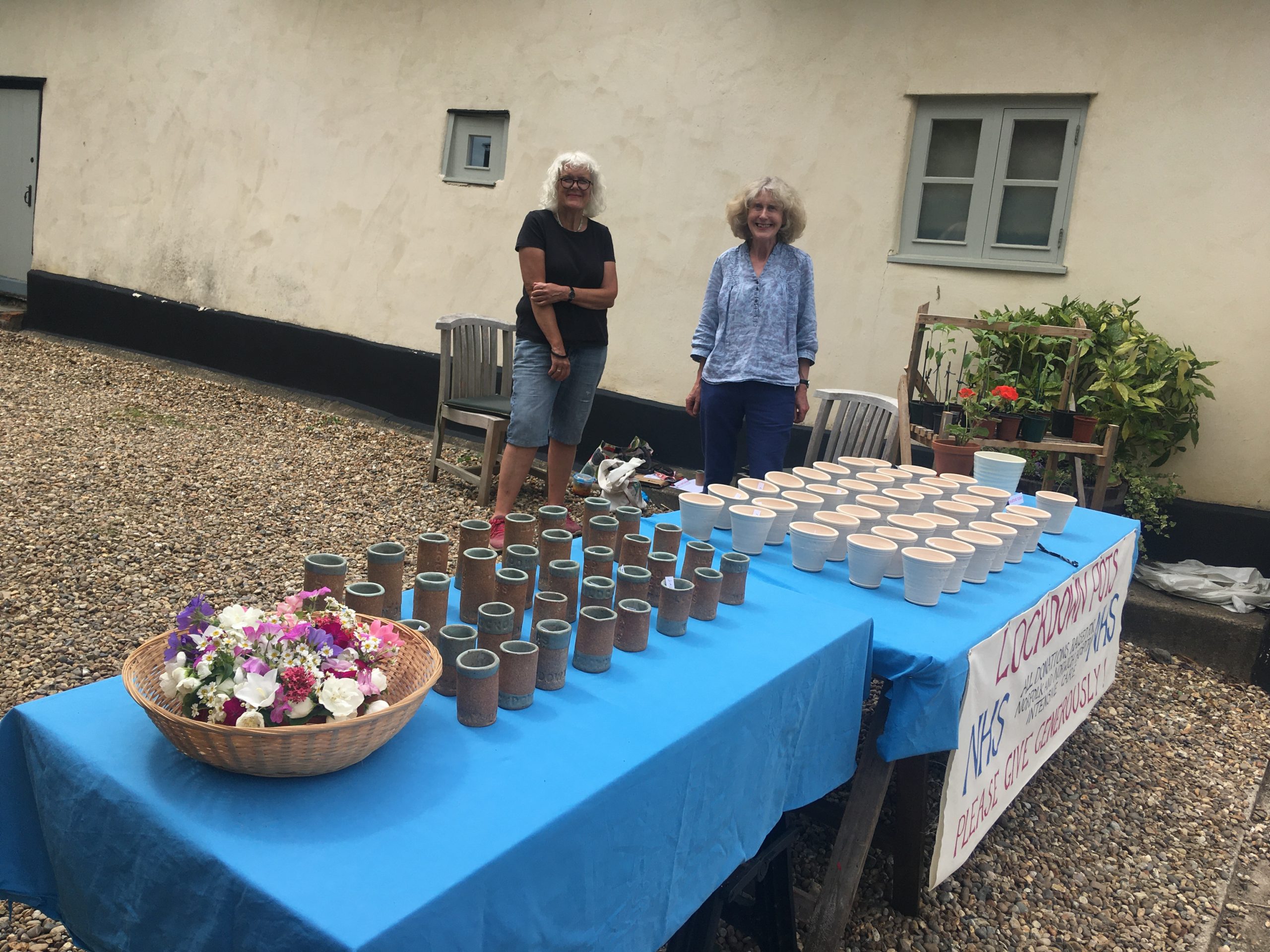 Jo, left, and Charlotte prepare for the sale